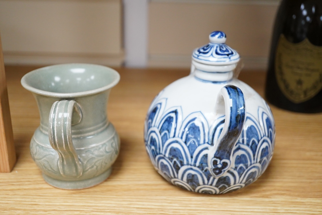 A Chinese blue and white teapot and cover, Xuande mark but later and a Chinese celadon glazed jug, tallest 13.5cm